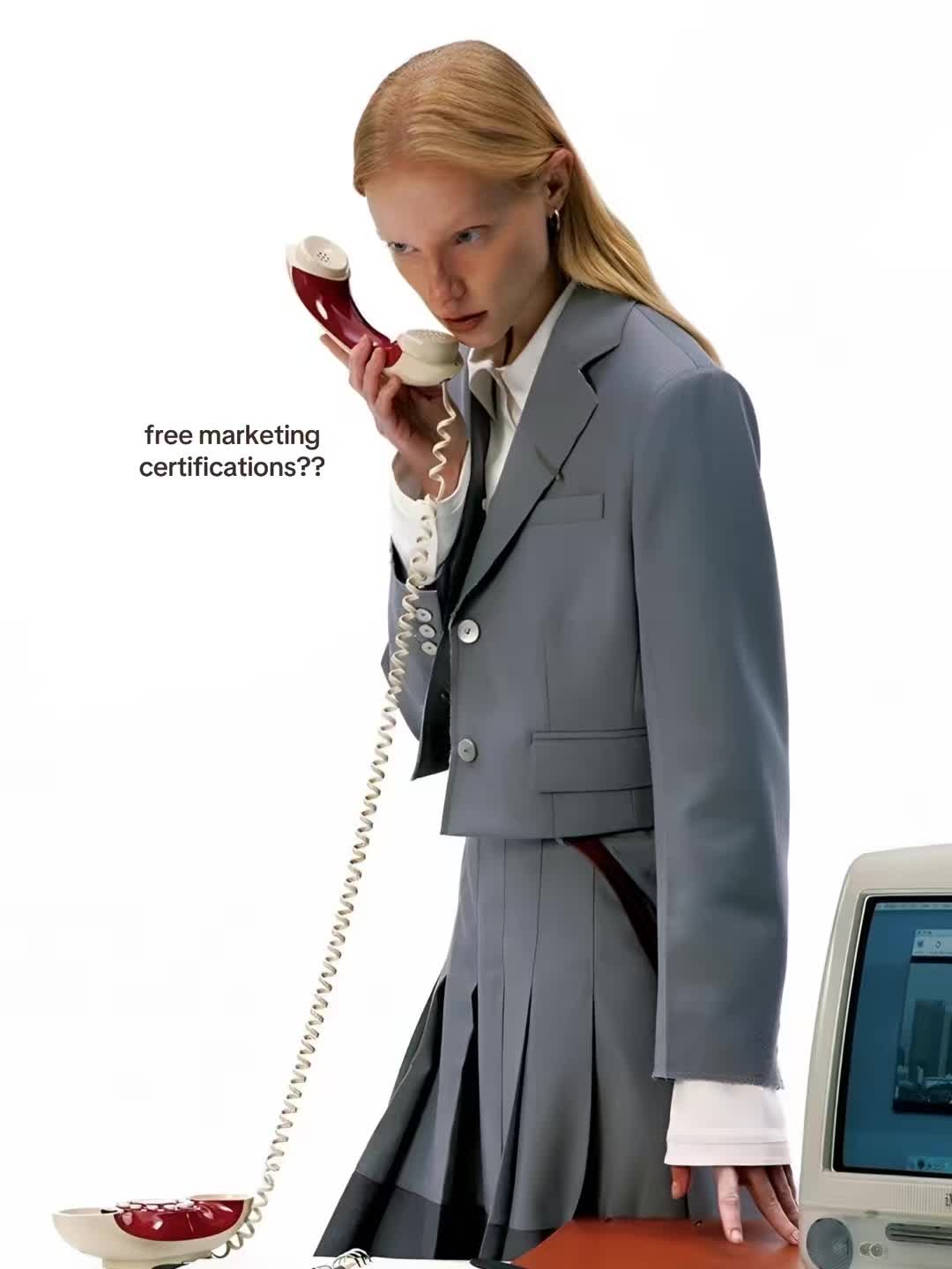 The first slide of Lu Casteli's photo post, showing a model in a grey suit holding a red telephone beside the words free marketing certifications.